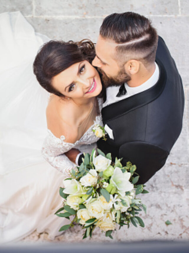 Beautiful wedding couple cuddling on their wedding day